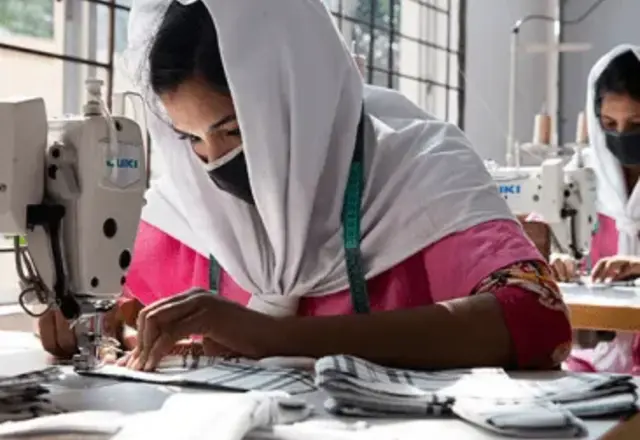 A woman working at a sewing machine